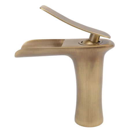 Close up of the open waterfall spout on the brass basin mixer