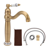 Antique brass basin mixer tap with blue and white porcelain detailing