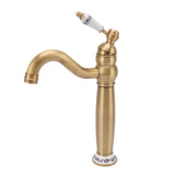 Side profile of the antique brass basin mixer with porcelain accents