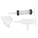 Handheld sausage stuffer showing piston barrel and handle