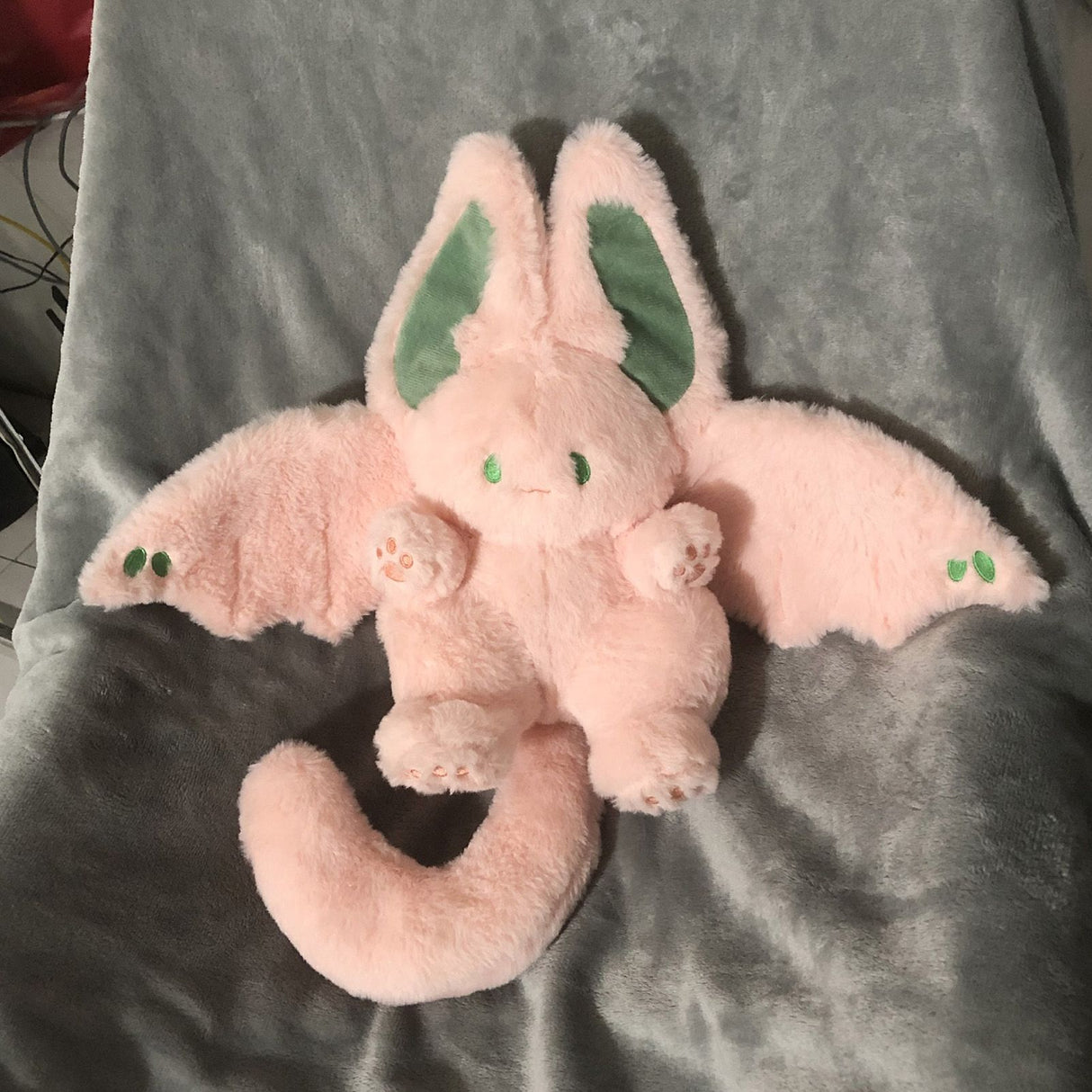 Pink stuffed bunny toy with little wings