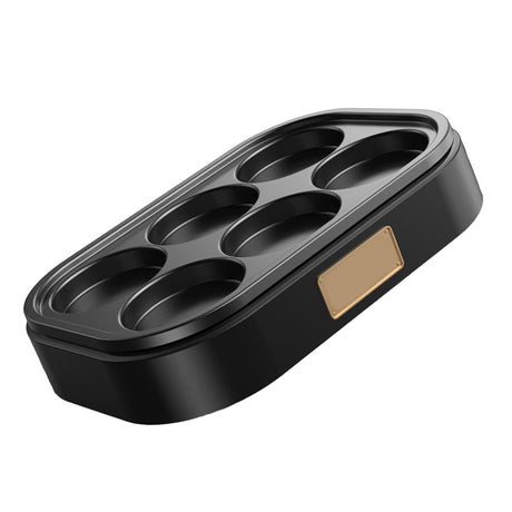 Top view of the six round wells in the aluminium alloy egg pan