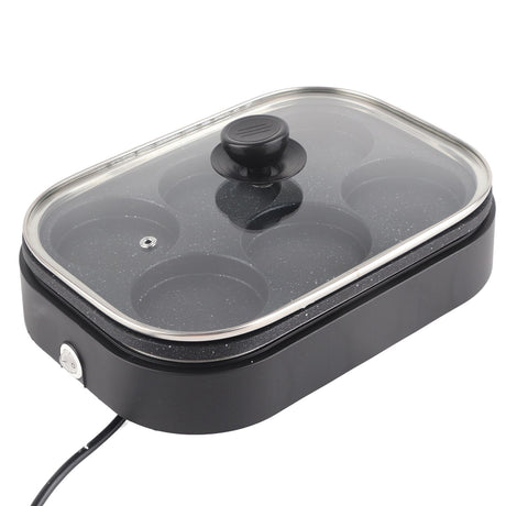 Top view of the six round wells in the aluminium alloy egg pan