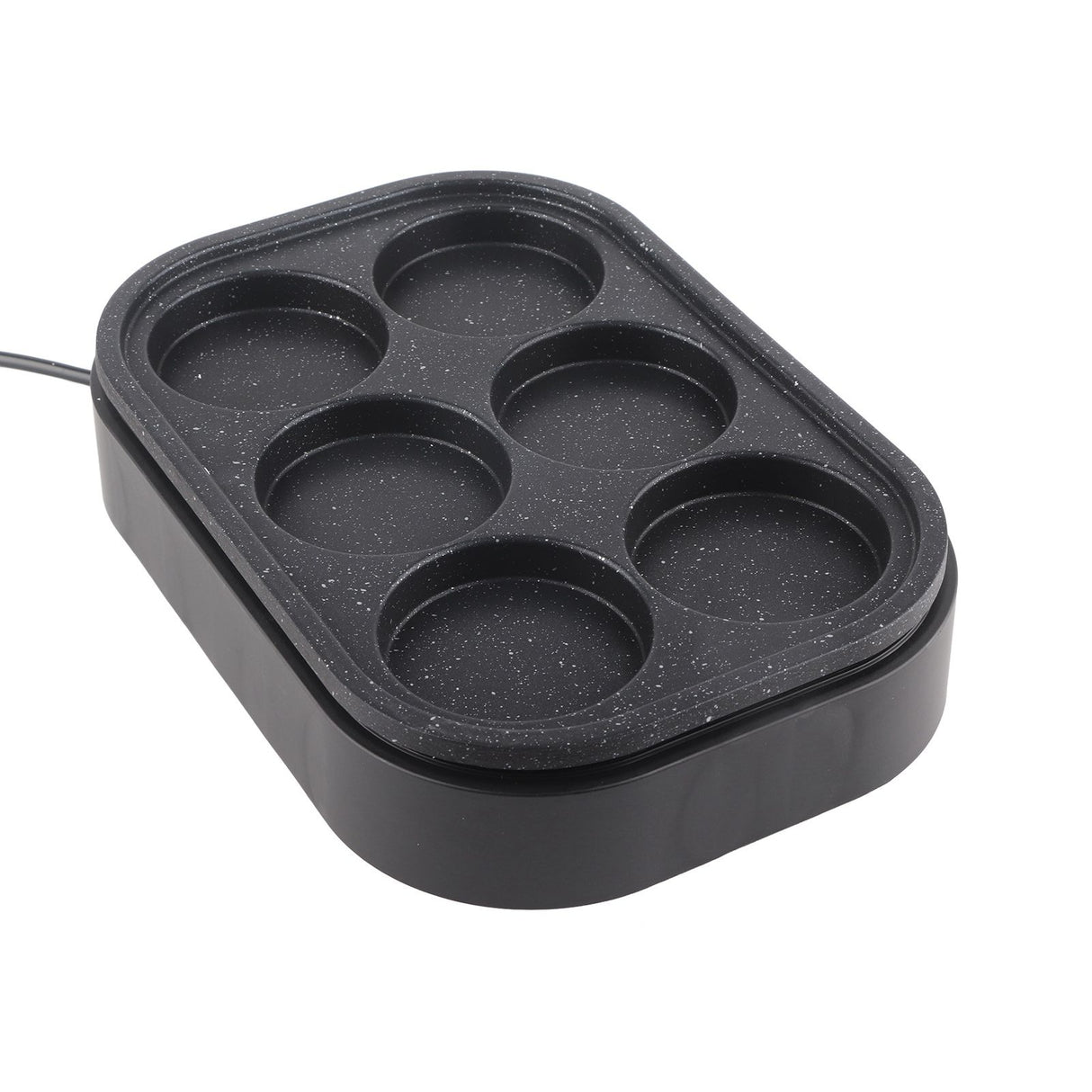 Six hole pan on a cooktop with eggs cooking