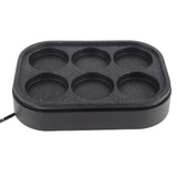 Underside of the black aluminium alloy six hole frying pan