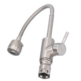 Mixer tap in use rinsing a sink with the stronger outlet mode