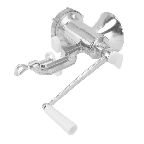 Manual meat grinder mincing beef on a kitchen bench