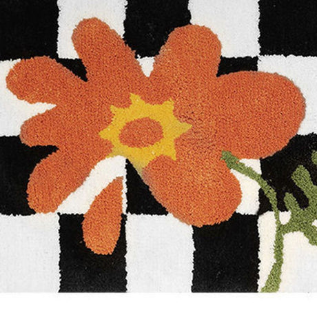 Checkered doormat placed in a kitchen in front of the sink for water absorption