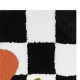 Checkered doormat pattern options in the black and white grid with orange flower design