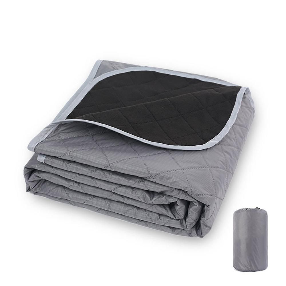 Windermere fleece picnic blanket in grey spread out on grass with a soft fleece top and water resistant polyester backing
