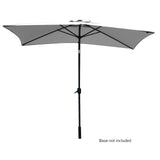 Grey 3 m outdoor umbrella with dark grey steel pole open in a garden