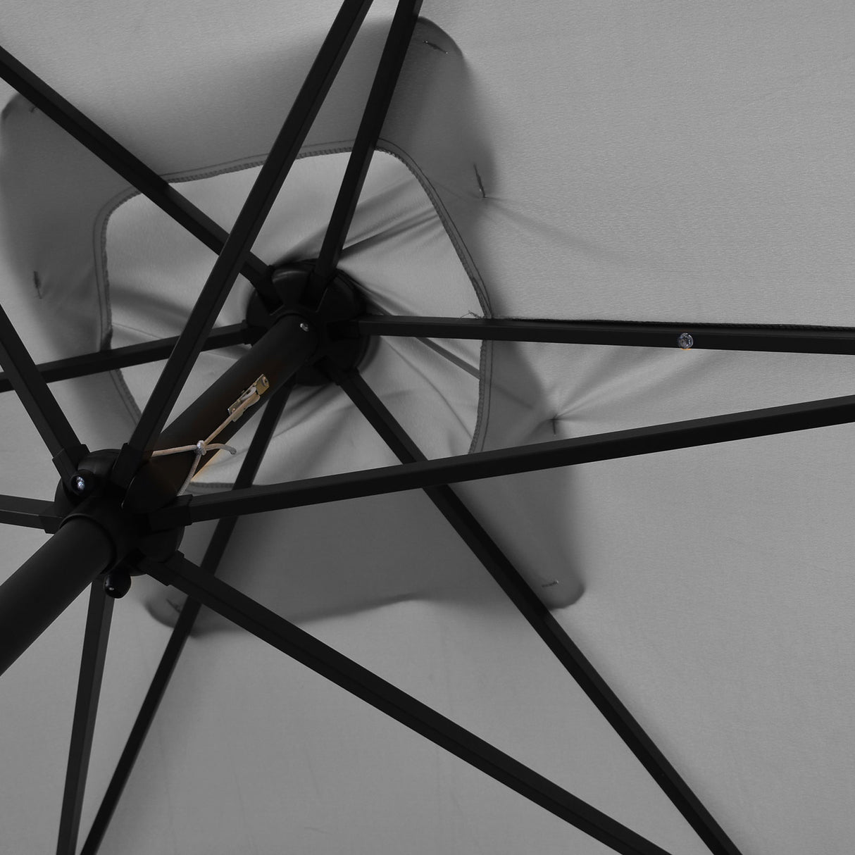 Solar LED lights glowing under the umbrella canopy at night