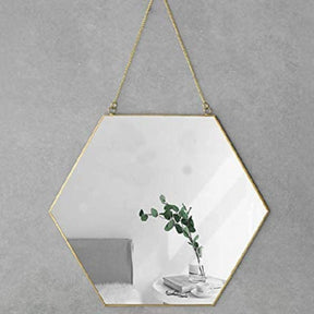 Marengo gold hexagon wall mirror on a feature wall