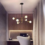 Six light Sputnik chandelier in black and gold