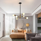 Six light Sputnik chandelier in black and gold