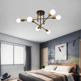 Six light mid century Sputnik chandelier in black and gold
