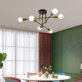 Six light mid century Sputnik chandelier in black and gold