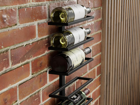 Matte black metal wall mounted wine rack holding 10 bottles