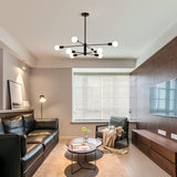 Eight light Sputnik chandelier in black and gold
