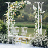 Angled view of the white metal garden arch showing its curved top and side panels