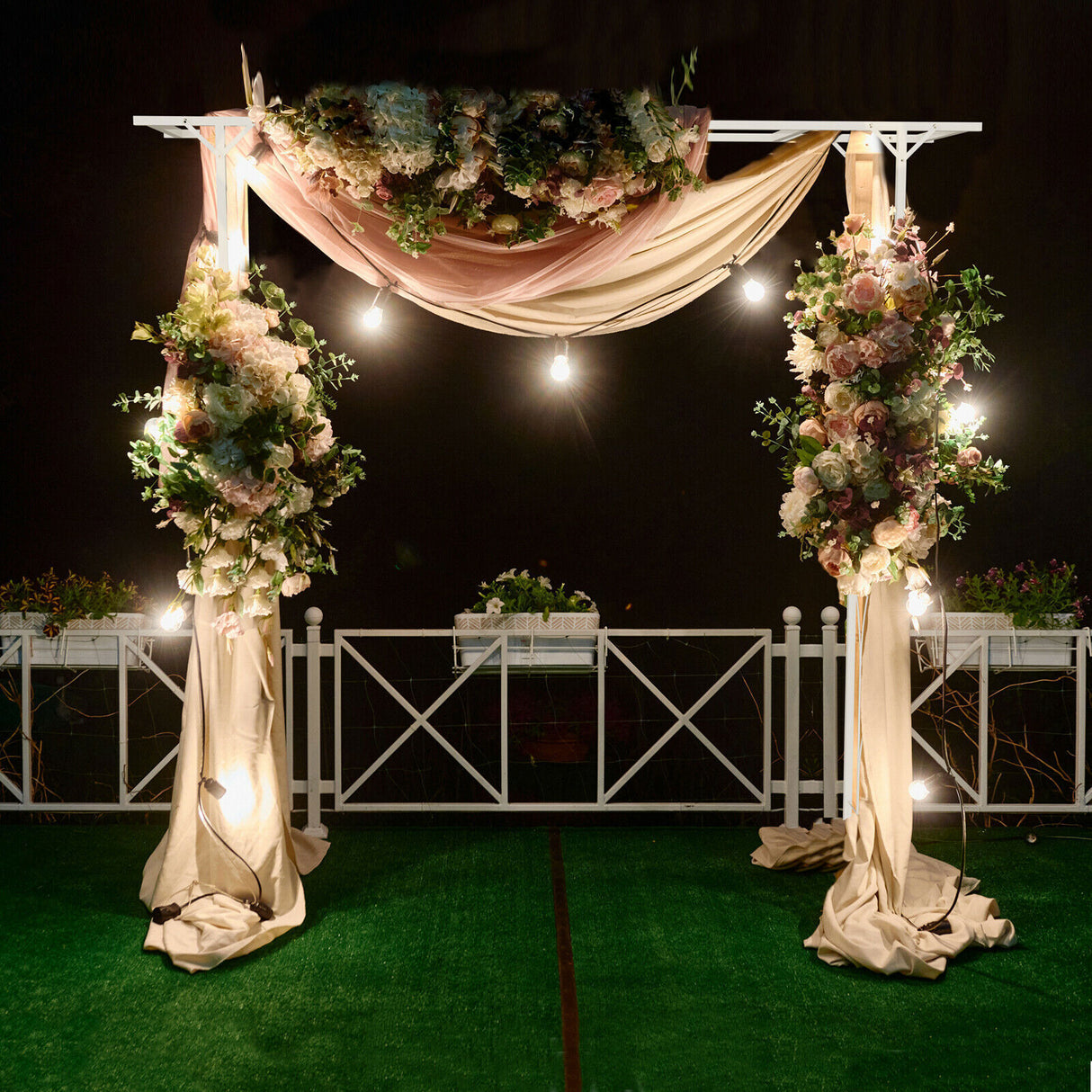 Close up of the white coated metal frame and lattice detail of the garden arch
