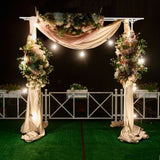Close up of the white coated metal frame and lattice detail of the garden arch