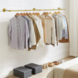 Gold wall mounted clothes rail in vintage iron