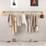 Gold wall mounted clothes rail in vintage iron