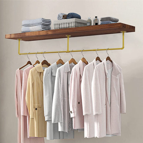 Gold wall mounted clothes rail in vintage iron
