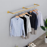 Gold wall mounted clothes rail in vintage iron
