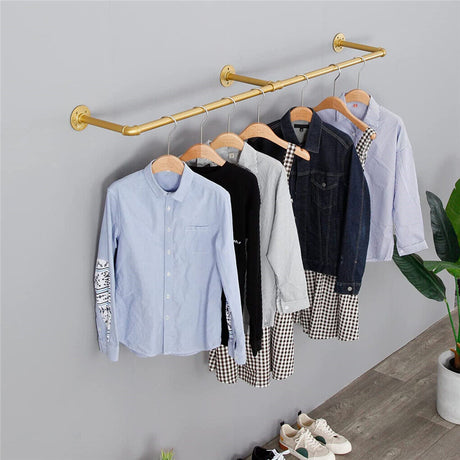 Gold wall mounted clothes rail in vintage iron