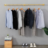 Gold wall mounted clothes rail in vintage iron