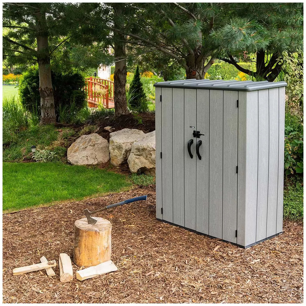Wood grain vertical storage shed in backyard setting