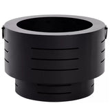 Howard Springs black steel low smoke fire pit burning wood in a backyard