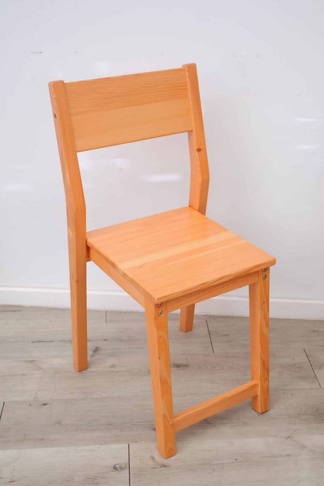 Classic wooden dining chair in a natural wood finish