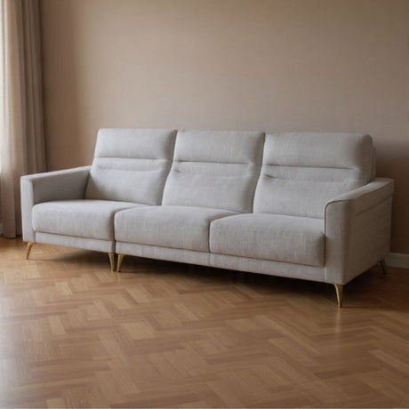 Bayview three seater sofa in light grey fabric with tapered black legs in a modern living room