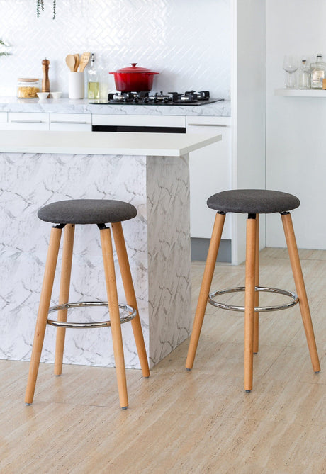 Mentone grey padded bar stool with cotton seat and steel frame in a modern kitchen