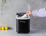 1.1 L water tank being filled in the portable ice maker