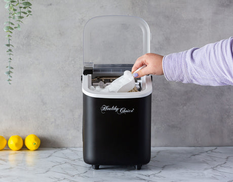 1.1 L water tank being filled in the portable ice maker