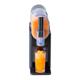 Frozen slushie being poured from the machine into a tall glass