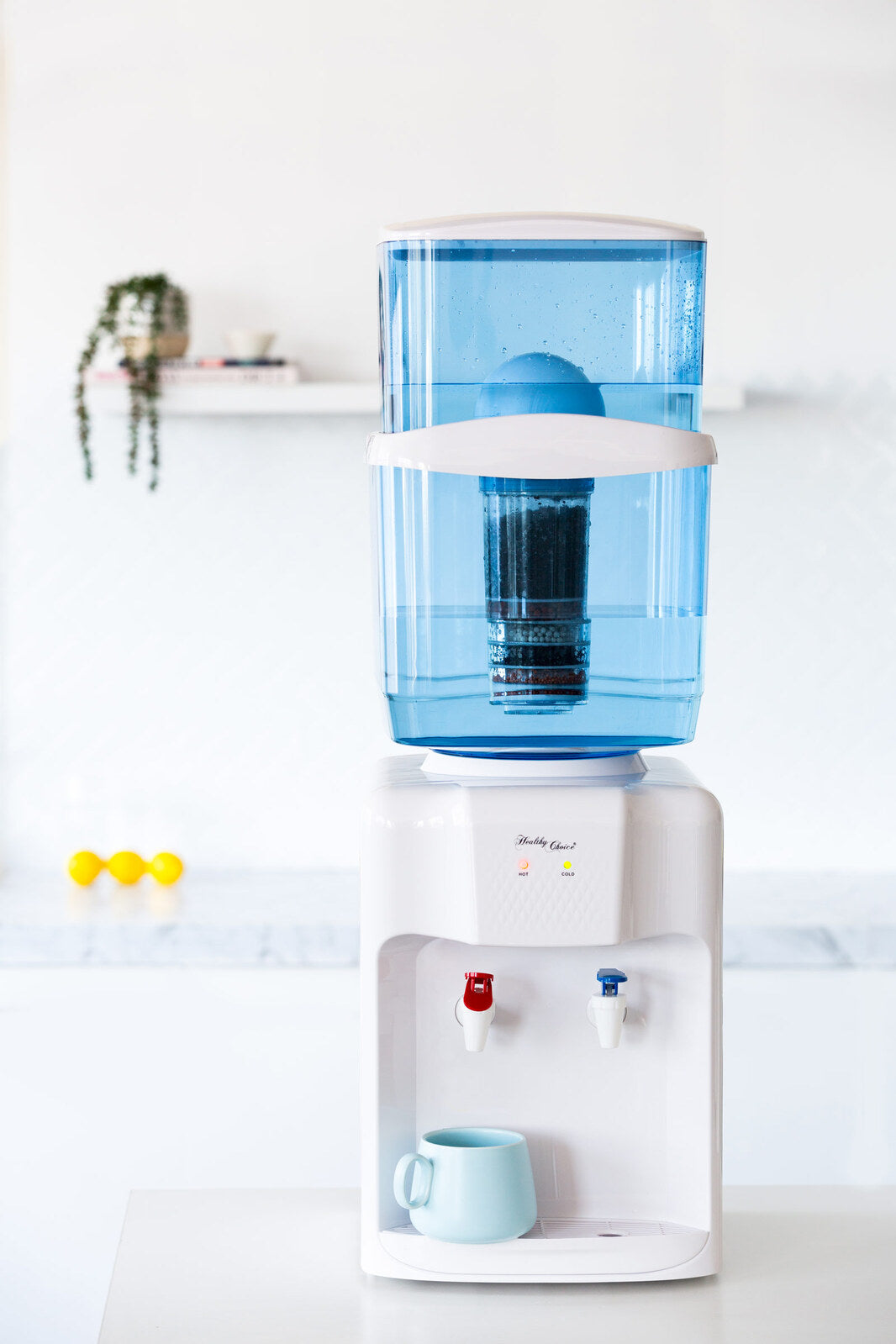 Close up of the hot and chilled water taps on the benchtop dispenser