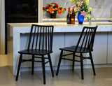 Dorrien black solid oak dining chair in a modern dining room