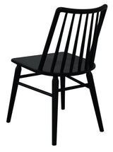 Dorrien black solid oak dining chair in a modern dining room