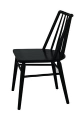 Dorrien black solid oak dining chair in a modern dining room