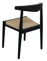 Vine Vale black solid oak dining chair with paper cord seat in a modern dining room