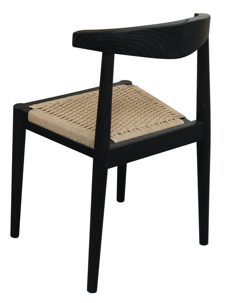 Vine Vale black solid oak dining chair with paper cord seat in a modern dining room
