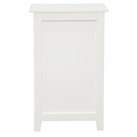 Ballina white solid mahogany three drawer bedside table with brass handles in a classic bedroom