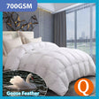 Goose feather and down quilt in white with a soft high loft on a made queen bed