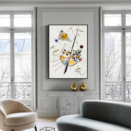 Black framed abstract canvas print styled on a neutral living room wall