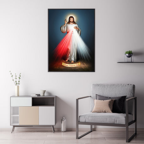 Black framed Divine Mercy canvas print styled on a plain interior wall